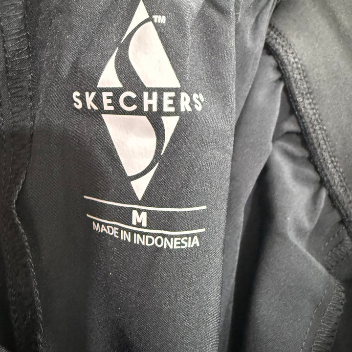 SKECHERS HYBRID PARACHUTE TRAINING SHORT BRAND NEW BLACK COLOUR WITH STRETCH WITH SIDE ZIP POCKETS