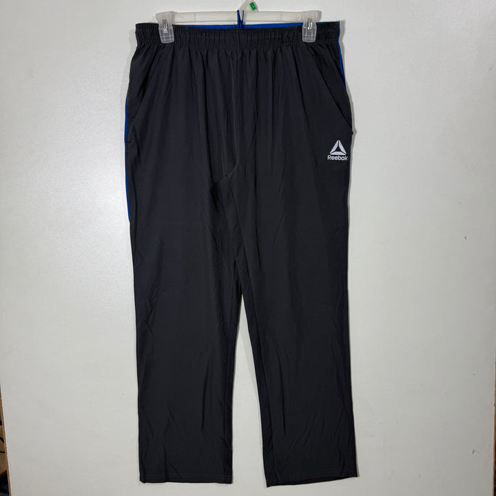 REEBOK LOOSE FIT HYBRID PARACHUTE TROUSER GREY COLOUR
