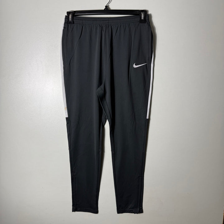 NIKE DRI FIT SPORT TROUSER SKINNY FIT WITH SIDE ZIP POCKETS GREY COLOUR