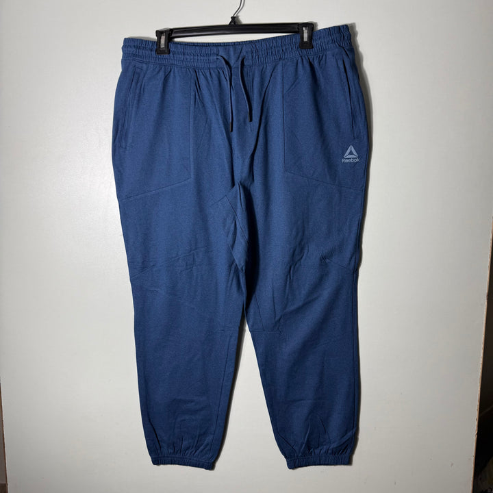 REEBOK FLEECE TROUSER WITH SIDE ZIP POCKETS BLUE COLOUR