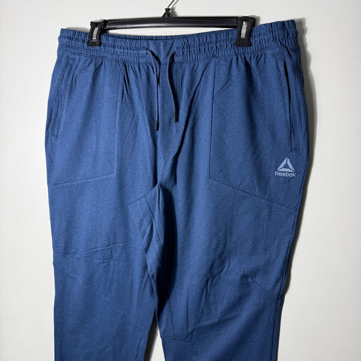 REEBOK FLEECE TROUSER WITH SIDE ZIP POCKETS BLUE COLOUR