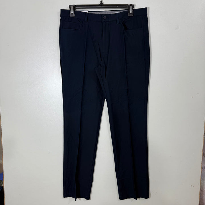 GREG NORMAN SLIM FIT ULTIMATE FIVE POCKETS TRAVEL PANT PERFORMANCE STRETCH WAISTBAND PERFORMANCE PANT BRAND NEW WITH FOUR WAY STRETCH BLUE COLOUR