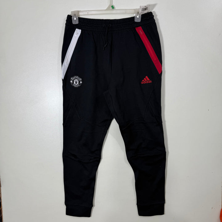 ADIDAS MANCHESTER UNITED TECH FLEECE TROUSER WITH SIDE ZIP POCKETS BRAND NEW BLACK COLOUR