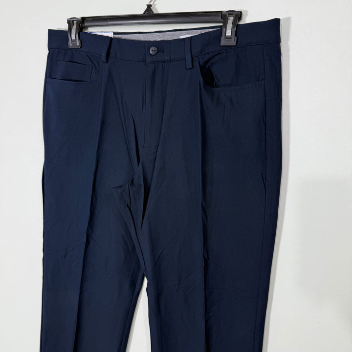 GREG NORMAN SLIM FIT ULTIMATE FIVE POCKETS TRAVEL PANT PERFORMANCE STRETCH WAISTBAND PERFORMANCE PANT BRAND NEW WITH FOUR WAY STRETCH BLUE COLOUR